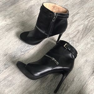 Open front boot heels by Guess